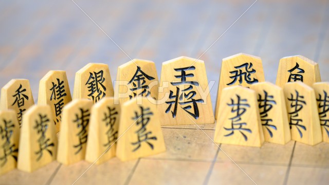 王将を中心にスクラムを組むイメージ